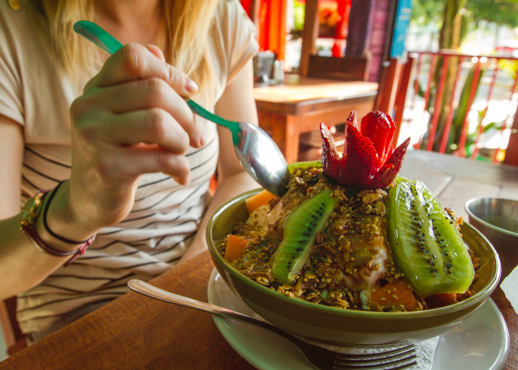 a traveller digs into a tasty fruit bowl in Mexico