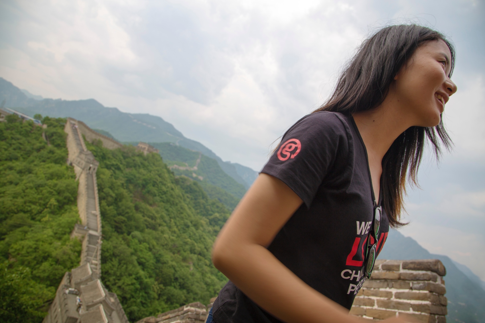 Great Wall of China tour guide a female CEO looks out over the Great Wall of China